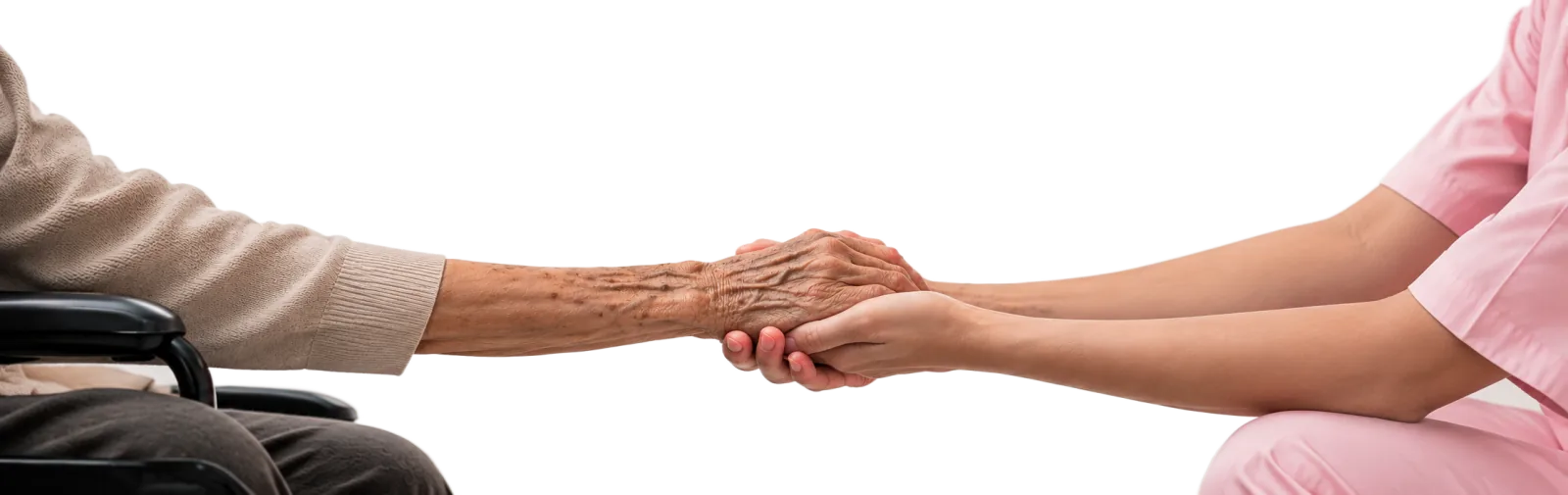 An older person's hands held gently by a caregiver